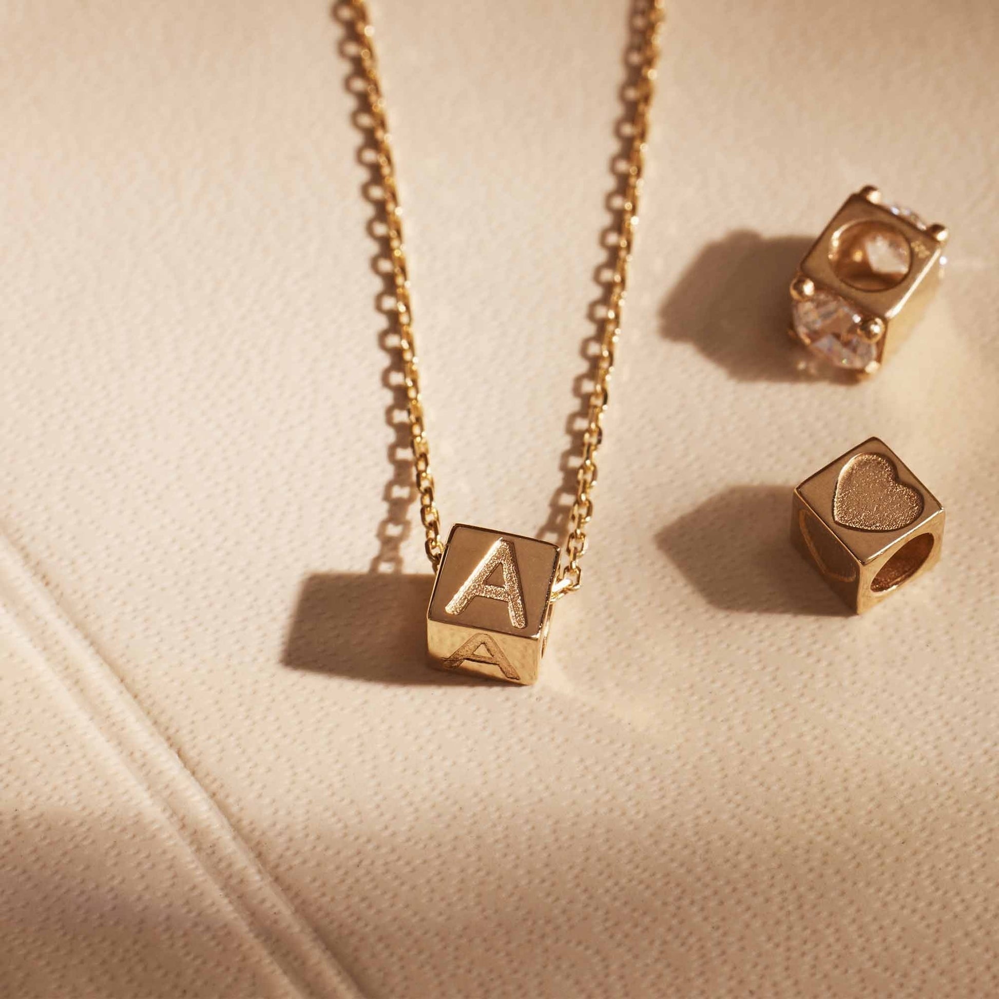 Le Marais Felie 14 karat gold cube initial charm with letter -  - Isabel Bernard